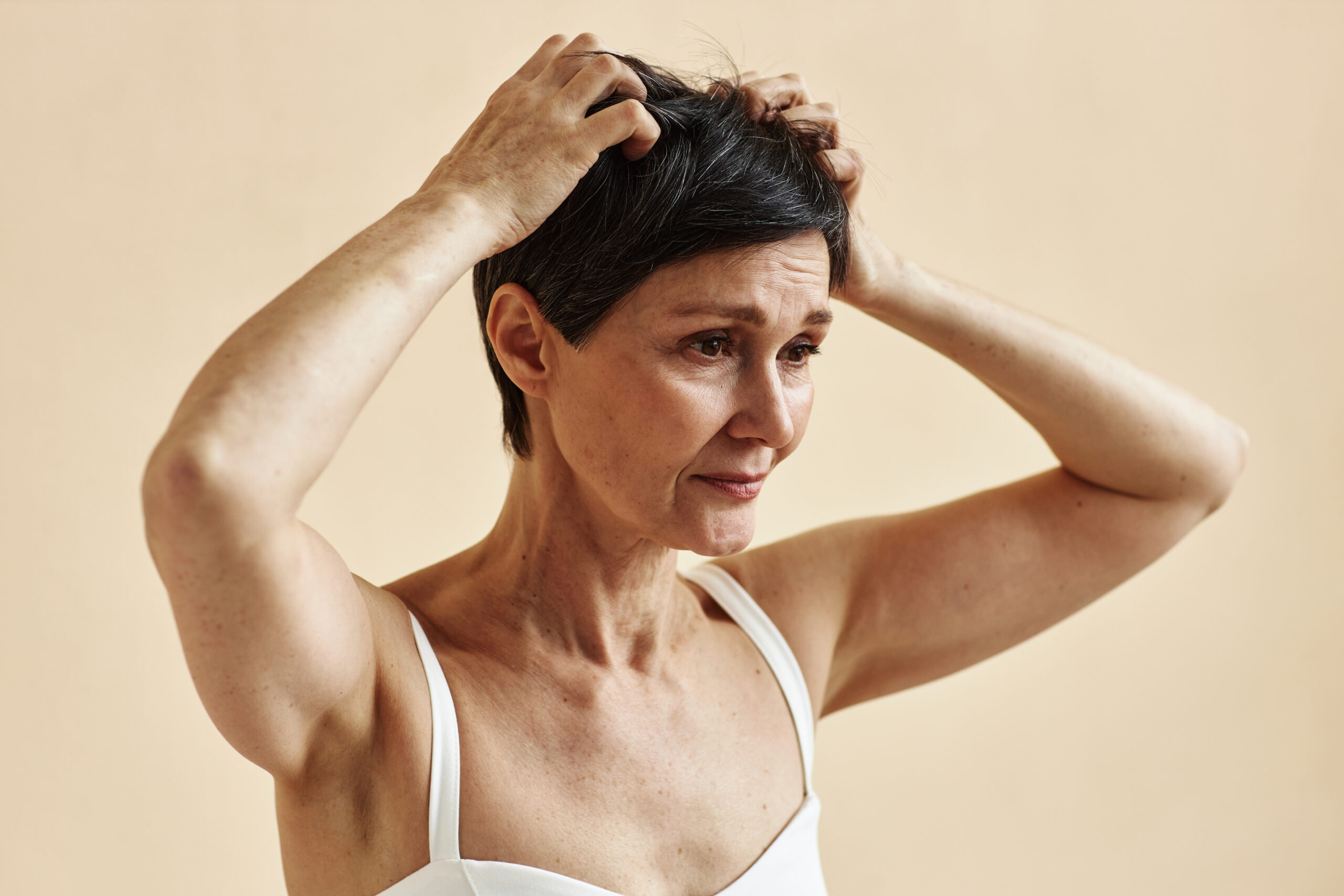 woman scratching her head